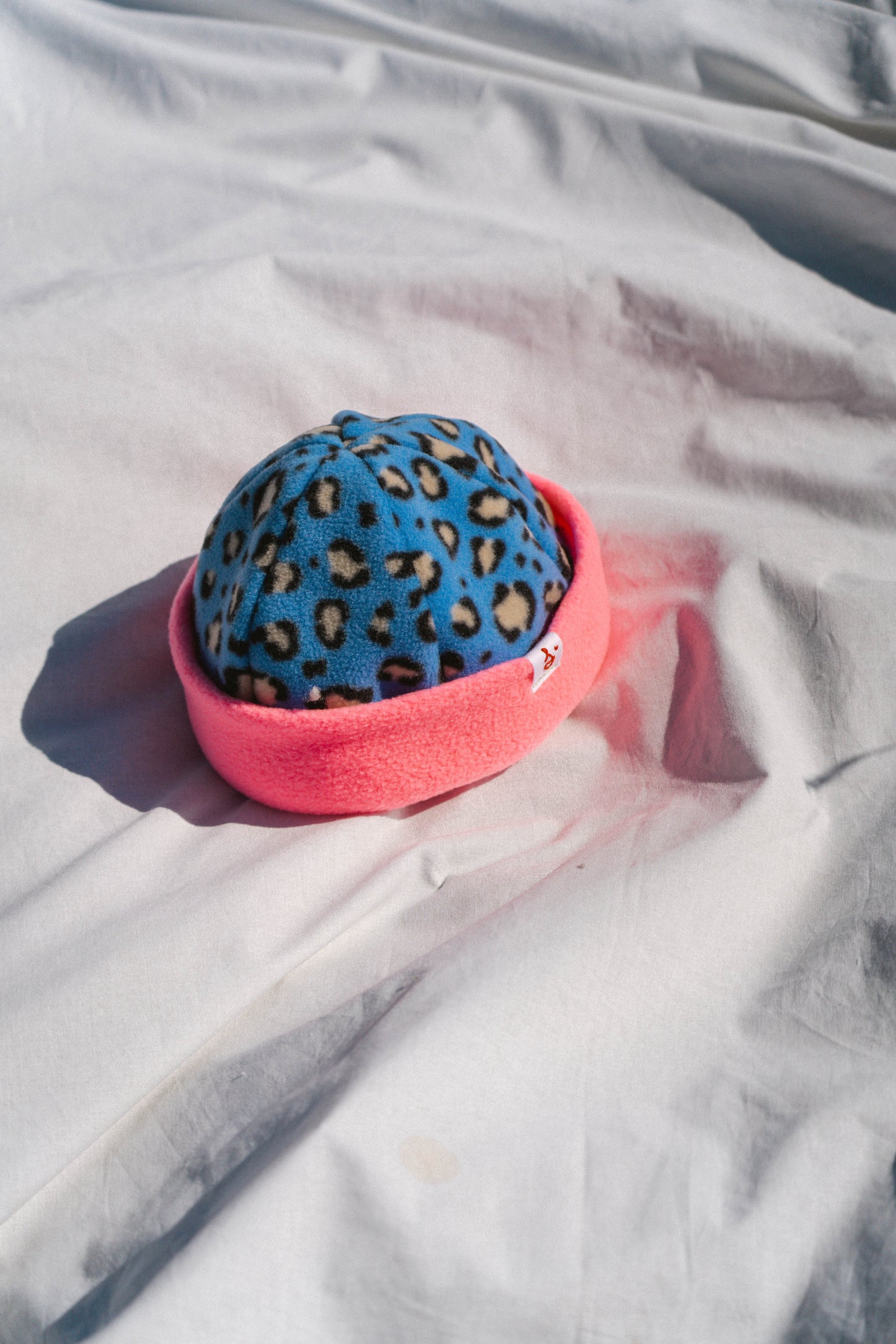 bonnet rose x leo bleu
